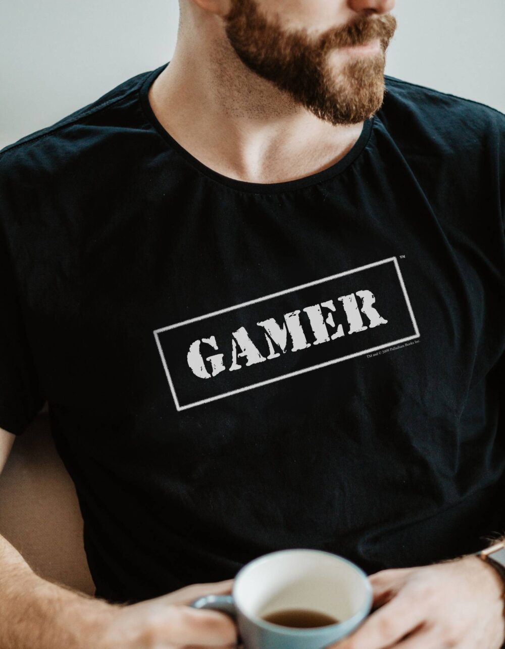 A black shirt with Gamer written in white on it