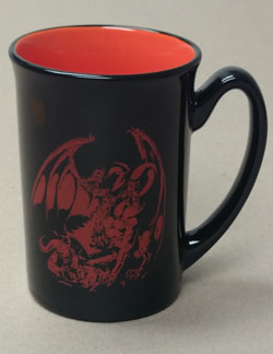 a black mug with a red dragon from the first edition palladium fantasy cover art. the inside of the mug is red